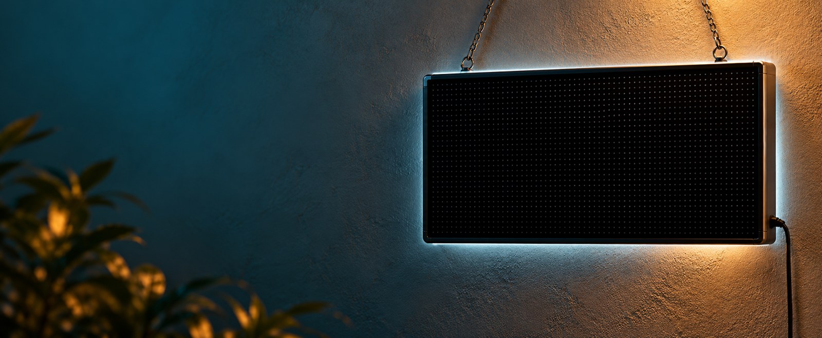 Blank LED sign mounted on a teal and amber wall